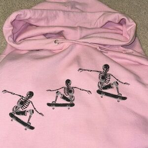 Pink Hoodie with Skeleton Skateboard Print